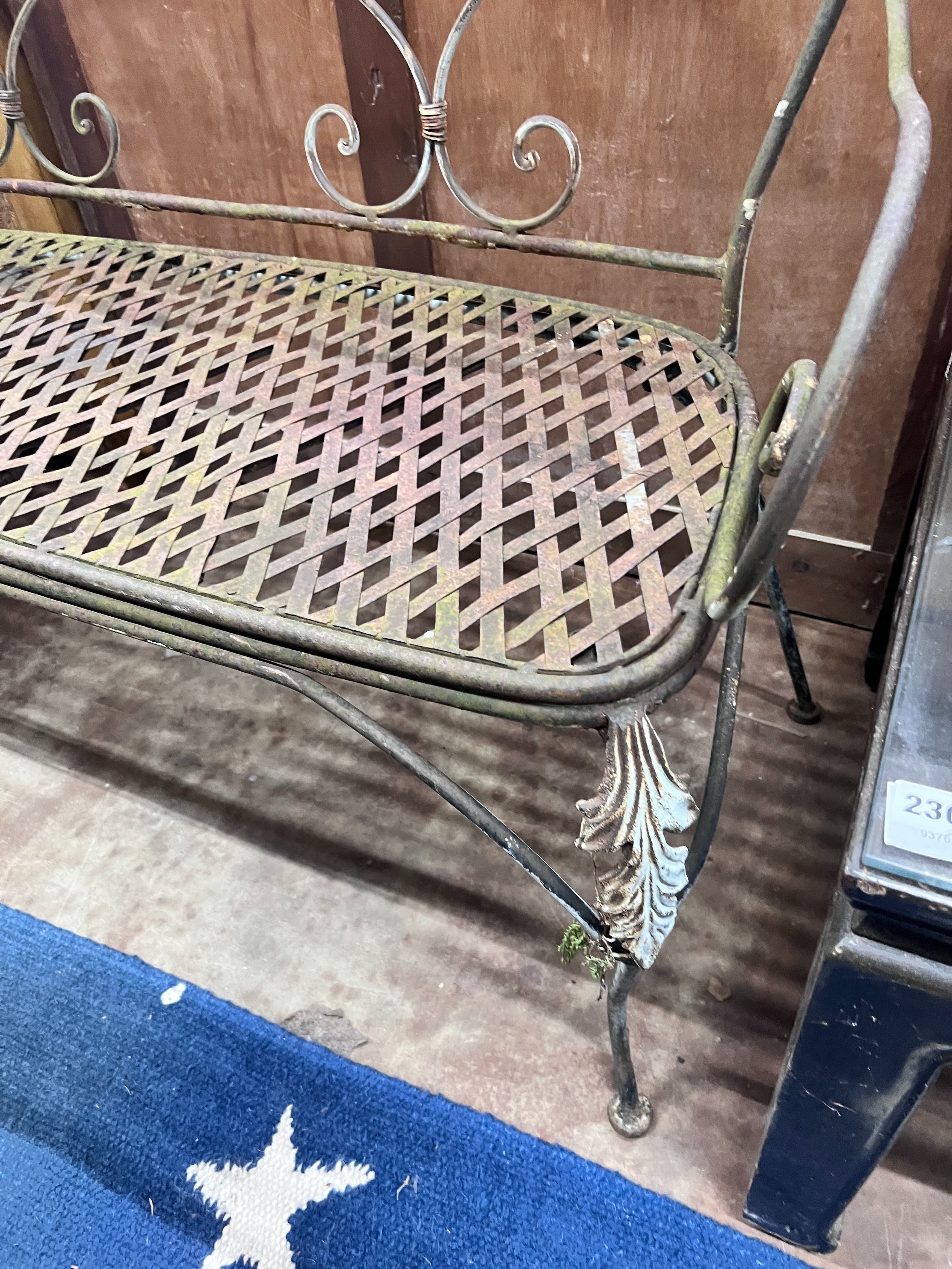 A wrought iron garden bench, width 120cm *Please note the sale commences at 9am.